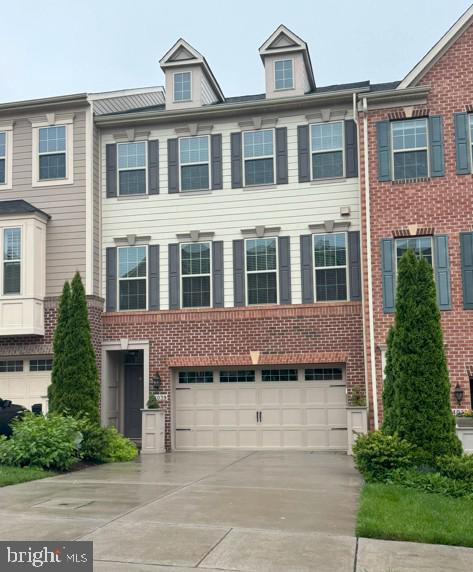 14039 Fox Hill Rd, Sparks Glencoe, MD 21152 - townhome / multi-family property with an attached garage, driveway, and brick siding