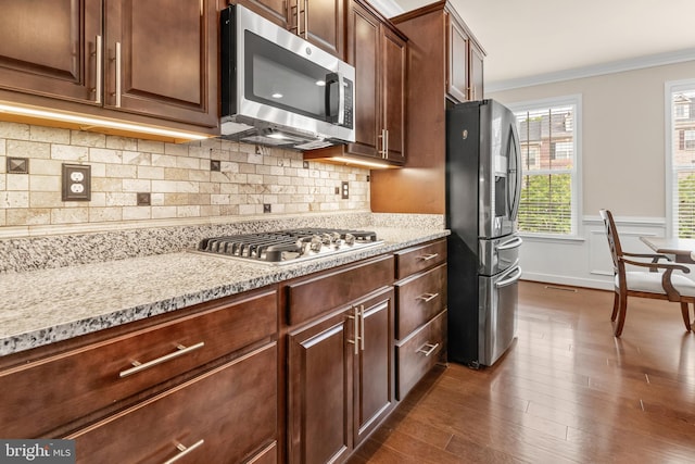 14039 Fox Hill Rd, Sparks, MD 21152 - kitchen with appliances with stainless steel finishes, crown molding, dark wood finished floors, a wainscoted wall, and tasteful backsplash