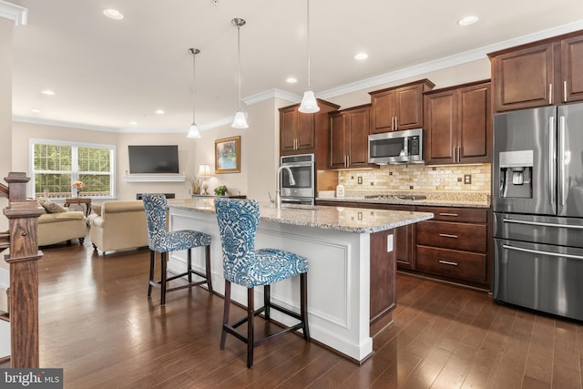 14039 Fox Hill Rd, Sparks, MD 21152 - kitchen featuring appliances with stainless steel finishes, a kitchen bar, crown molding, light stone counters, and dark wood-style flooring