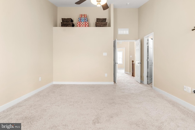 14039 Fox Hill Rd, Sparks, MD 21152 - carpeted empty room featuring a ceiling fan, a towering ceiling, and baseboards