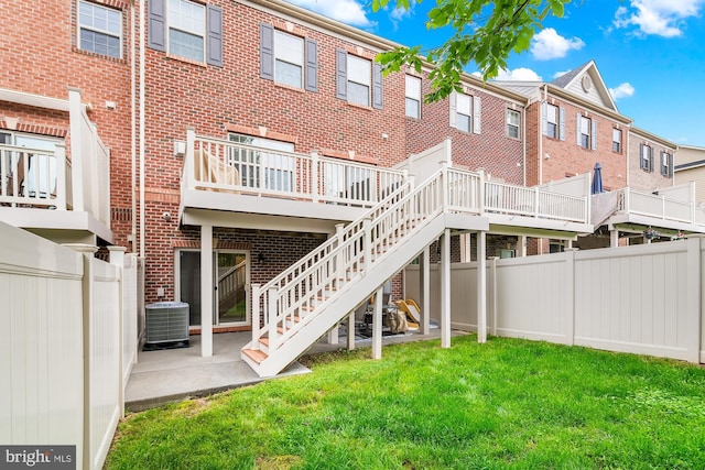 14039 Fox Hill Rd, Sparks, MD 21152 - back of property with brick siding, a wooden deck, stairs, and central AC