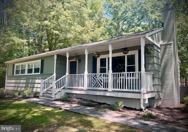 3450 Laurel Dr, Indian Head, MD 20640 - view of front of house featuring covered porch and a chimney