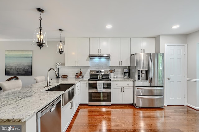 11920 Mays Chapel Rd, Lutherville Timonium, MD 21093 - kitchen with stainless steel appliances, a sink, a peninsula, white cabinets, and backsplash