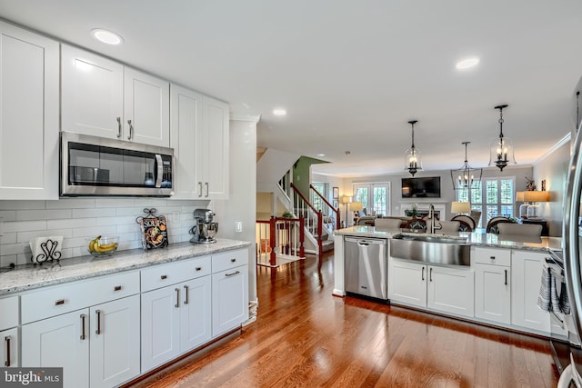 11920 Mays Chapel Rd, Lutherville Timonium, MD 21093 - kitchen with appliances with stainless steel finishes, open floor plan, white cabinetry, backsplash, and recessed lighting