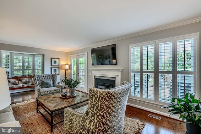 11920 Mays Chapel Rd, Lutherville Timonium, MD 21093 - living room featuring crown molding, a fireplace, and wood finished floors