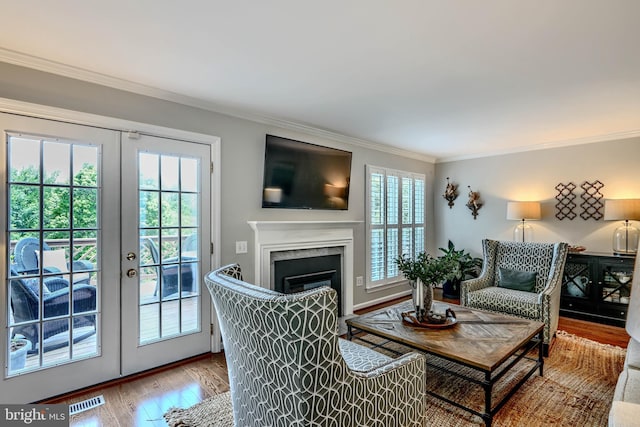 11920 Mays Chapel Rd, Lutherville Timonium, MD 21093 - living room with french doors, ornamental molding, wood finished floors, and a fireplace with flush hearth