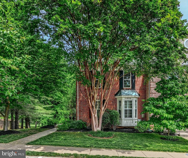 11920 Mays Chapel Rd, Lutherville Timonium, MD 21093 - view of front of house with brick siding and a front lawn
