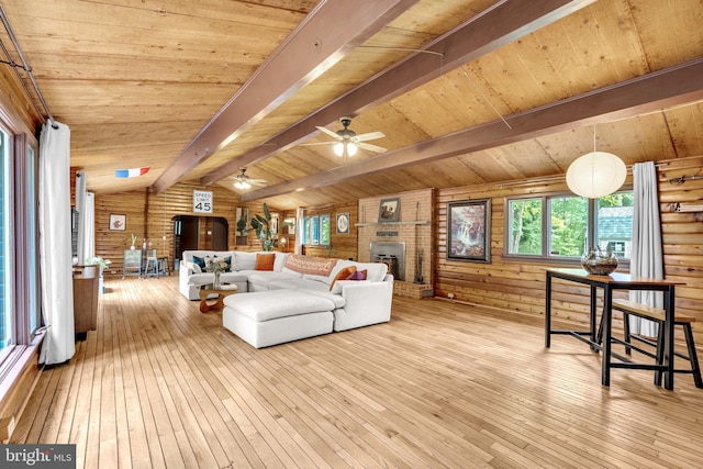 11621 Deadwood Dr, Lusby, MD 20657 - living area featuring wood-type flooring, wood ceiling, a brick fireplace, and ceiling fan
