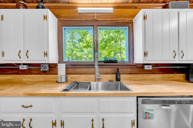 11621 Deadwood Dr, Lusby, MD 20657 - kitchen with stainless steel dishwasher, a sink, white cabinets, wooden ceiling, and wooden counters