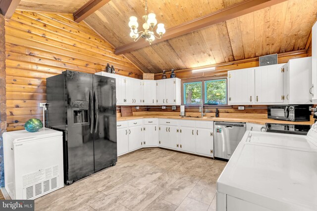 11621 Deadwood Dr, Lusby, MD 20657 - kitchen with black appliances, wooden ceiling, light countertops, rustic walls, and a chandelier