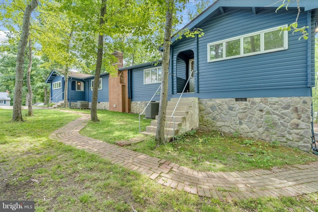11621 Deadwood Dr, Lusby, MD 20657 - view of front facade featuring a front lawn, central AC unit, and crawl space