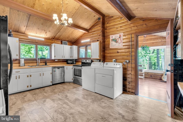 11621 Deadwood Dr, Lusby, MD 20657 - kitchen featuring black appliances, washing machine and dryer, a sink, plenty of natural light, and wooden ceiling