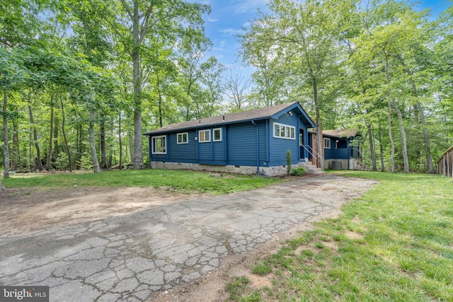 11621 Deadwood Dr, Lusby, MD 20657 - view of front of house featuring driveway, roof with shingles, a front lawn, and crawl space