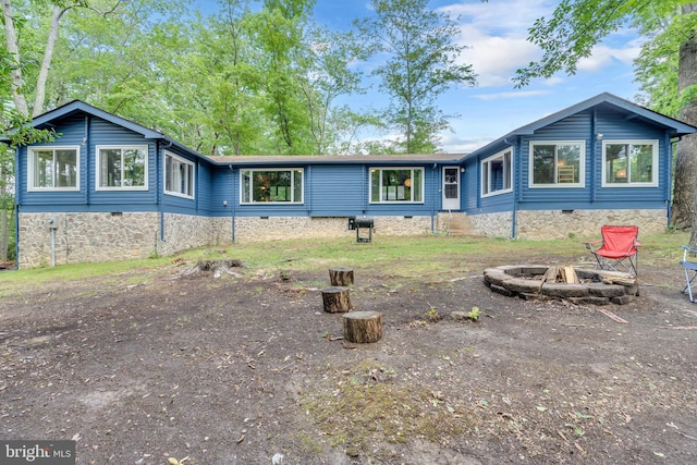 11621 Deadwood Dr, Lusby, MD 20657 - back of house featuring a fire pit