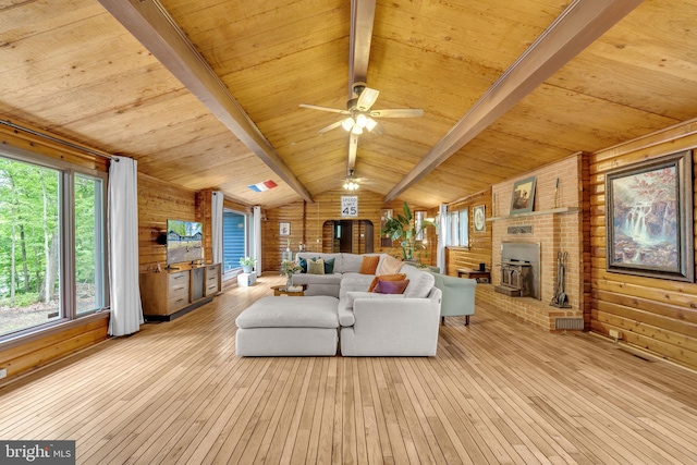 11621 Deadwood Dr, Lusby, MD 20657 - living area featuring wood ceiling, hardwood / wood-style floors, a ceiling fan, a fireplace, and wood walls