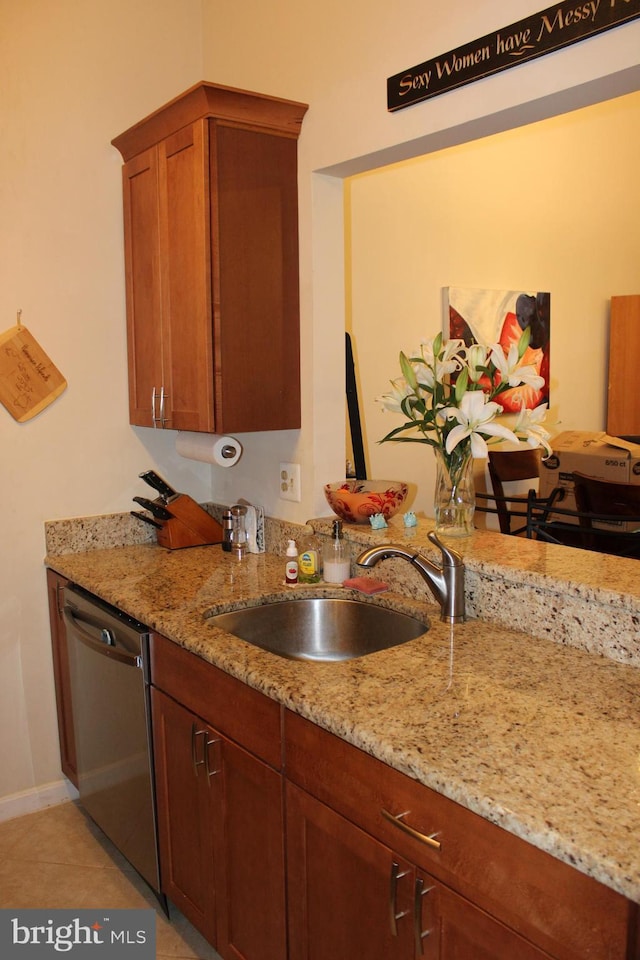 600 Moonglow Rd Unit 302, Odenton, MD 21113 - kitchen featuring stainless steel dishwasher, a sink, and light stone counters