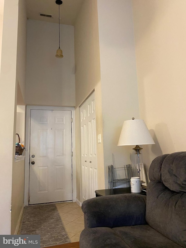 600 Moonglow Rd Unit 302, Odenton, MD 21113 - tiled foyer entrance featuring a towering ceiling and baseboards