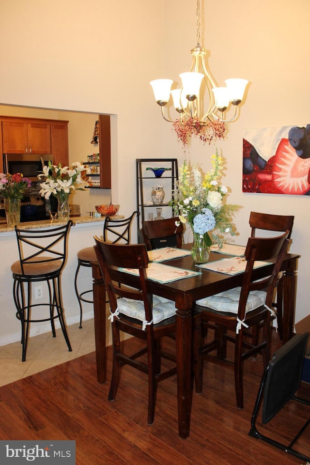 600 Moonglow Rd Unit 302, Odenton, MD 21113 - dining space featuring a chandelier and wood finished floors