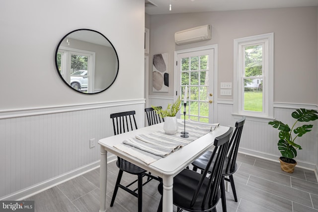 609 Eldrid Dr, Silver Spring, MD 20904 - dining area with an AC wall unit, wainscoting, and wood finish floors