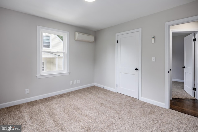 609 Eldrid Dr, Silver Spring, MD 20904 - unfurnished bedroom featuring a wall unit AC, carpet flooring, and baseboards