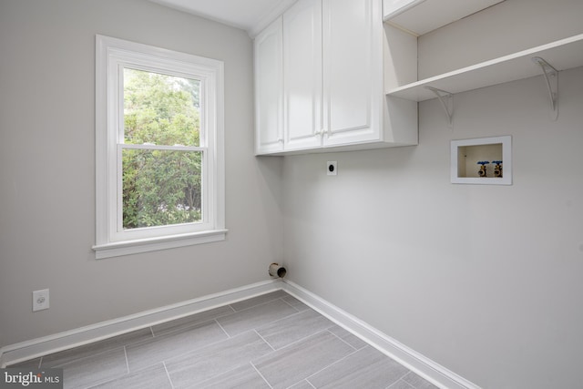 609 Eldrid Dr, Silver Spring, MD 20904 - washroom with cabinet space, hookup for an electric dryer, hookup for a washing machine, and baseboards
