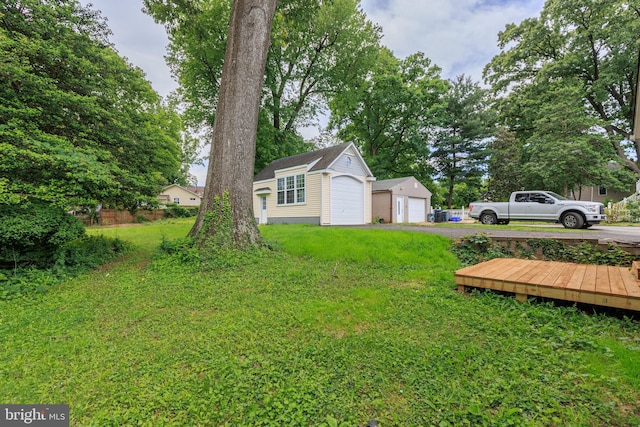 609 Eldrid Dr, Silver Spring, MD 20904 - view of grassy yard with a garage and an outdoor structure