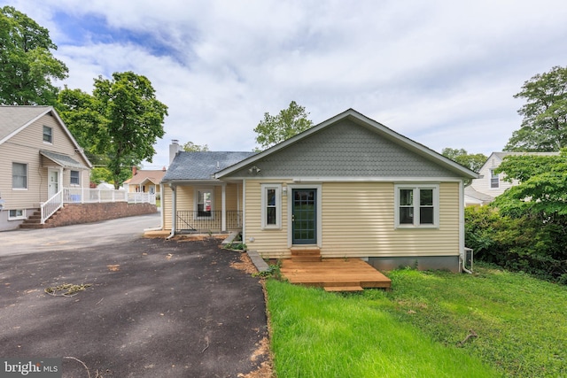 609 Eldrid Dr, Silver Spring, MD 20904 - bungalow-style home with driveway and a chimney
