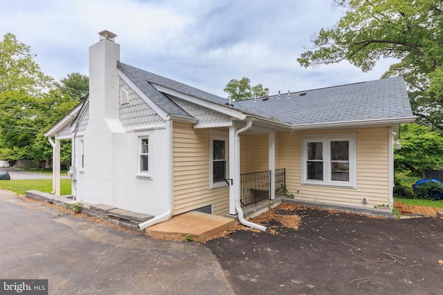 609 Eldrid Dr, Silver Spring, MD 20904 - rear view of house featuring a chimney and a shingled roof