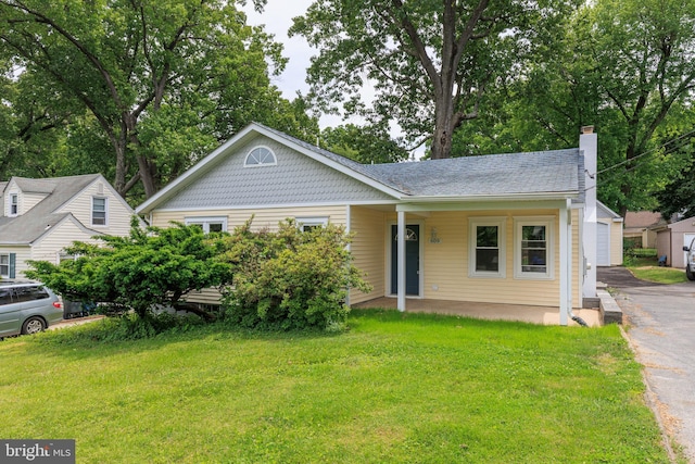 609 Eldrid Dr, Silver Spring, MD 20904 - view of front of house featuring a front lawn, a porch, and a chimney
