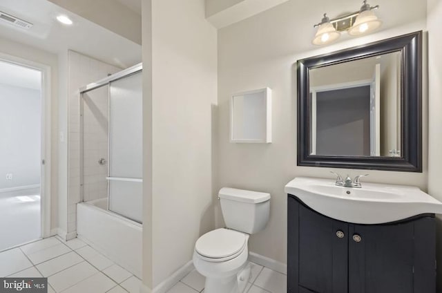 8 Rivers Edge Ter, Indian Head, MD 20640 - bathroom with vanity, toilet, combined bath / shower with glass door, tile patterned floors, and baseboards