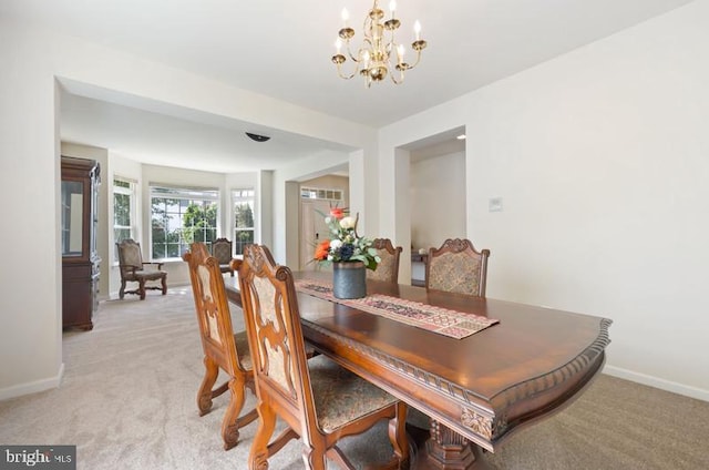 8 Rivers Edge Ter, Indian Head, MD 20640 - dining space with light colored carpet, baseboards, and a chandelier