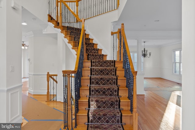 14603 Turner Wootton Pkwy, Upper Marlboro, MD 20774 - stairway with wood finished floors, ornamental molding, and a chandelier