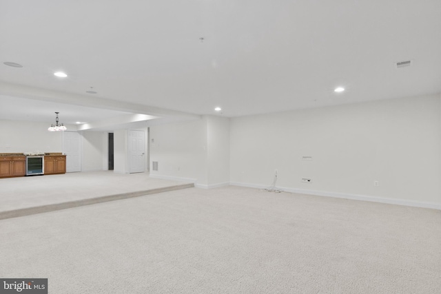 14603 Turner Wootton Pkwy, Upper Marlboro, MD 20774 - below grade area featuring beverage cooler, recessed lighting, light colored carpet, baseboards, and a chandelier