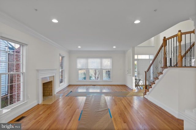 14603 Turner Wootton Pkwy, Upper Marlboro, MD 20774 - unfurnished living room featuring a high end fireplace, wood finished floors, baseboards, stairs, and recessed lighting