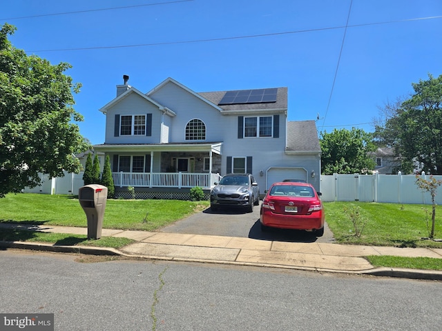 355 Leonard Ave, Hamilton, NJ 08619 - view of front facade featuring a porch, driveway, solar panels, and a chimney