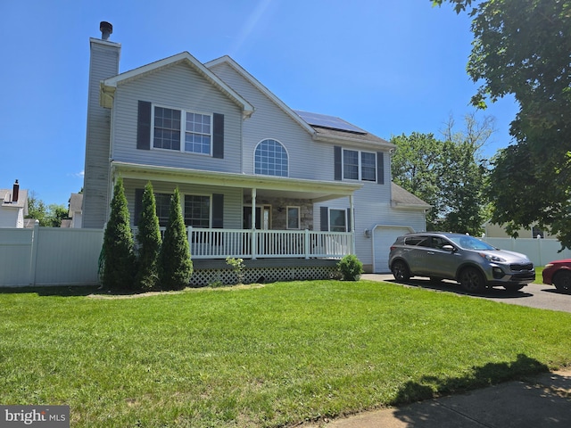 355 Leonard Ave, Hamilton, NJ 08619 - view of front of property with a porch, solar panels, an attached garage, a chimney, and driveway