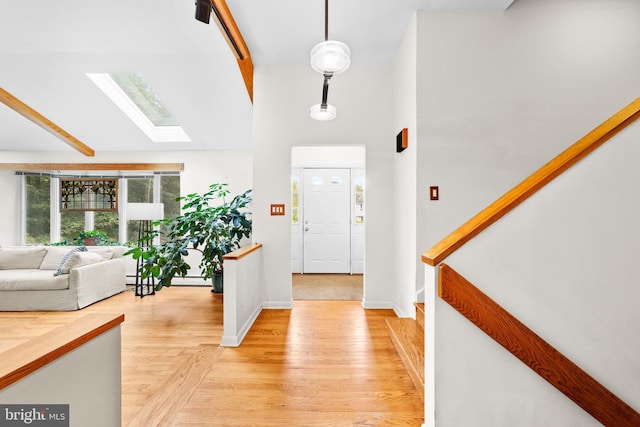 3 Vanderveer Dr, Lawrenceville, NJ 08648 - foyer entrance featuring a skylight, light wood-style flooring, high vaulted ceiling, baseboards, and beam ceiling