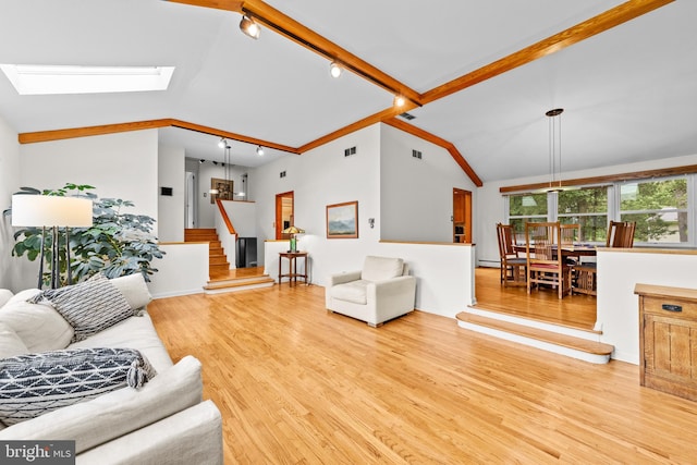 3 Vanderveer Dr, Lawrenceville, NJ 08648 - living area with wood finished floors, stairs, a skylight, and track lighting