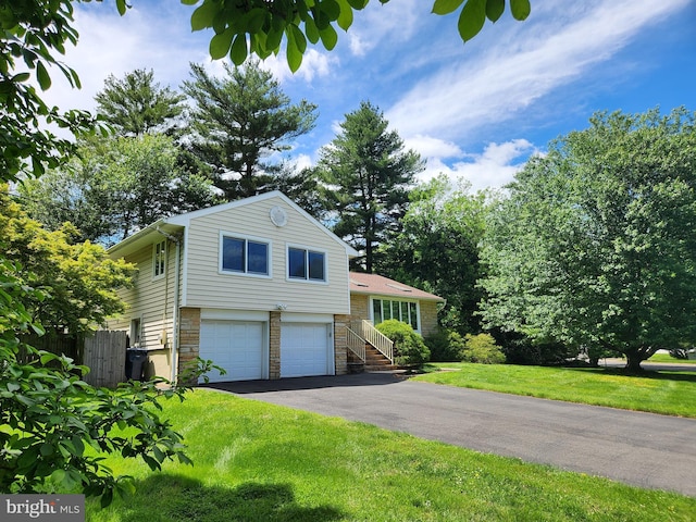 3 Vanderveer Dr, Lawrenceville, NJ 08648 - tri-level home featuring driveway, an attached garage, and stone siding