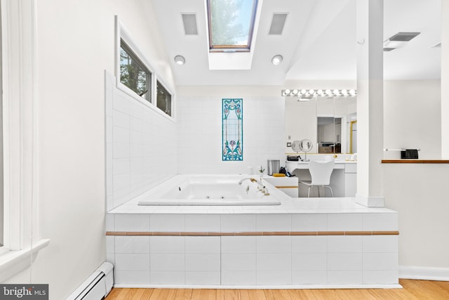 3 Vanderveer Dr, Lawrenceville, NJ 08648 - bathroom featuring a tub with jets, baseboard heating, a skylight, wood finished floors, and baseboards
