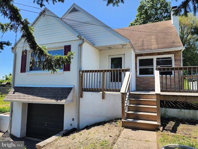 3131 Concord Rd, Aston, PA 19014 - view of front of property with brick siding, a garage, a chimney, and a shingled roof