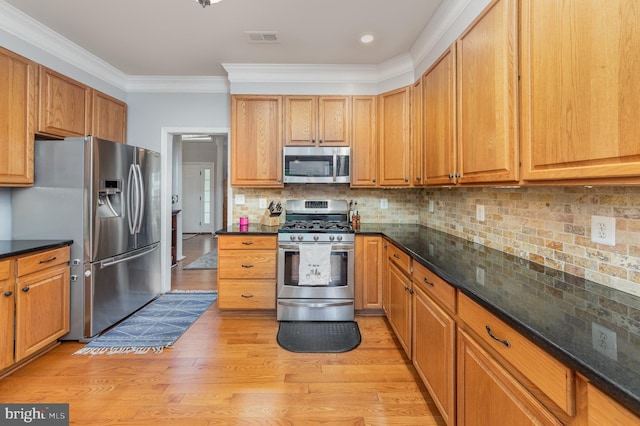 18 Basket Ct, Stafford, VA 22554 - kitchen with stainless steel appliances, light wood-style floors, ornamental molding, backsplash, and dark stone countertops
