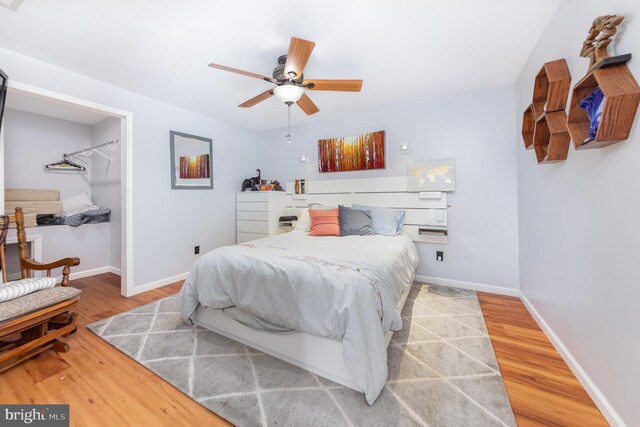 18 Basket Ct, Stafford, VA 22554 - bedroom featuring wood finished floors, a spacious closet, and baseboards