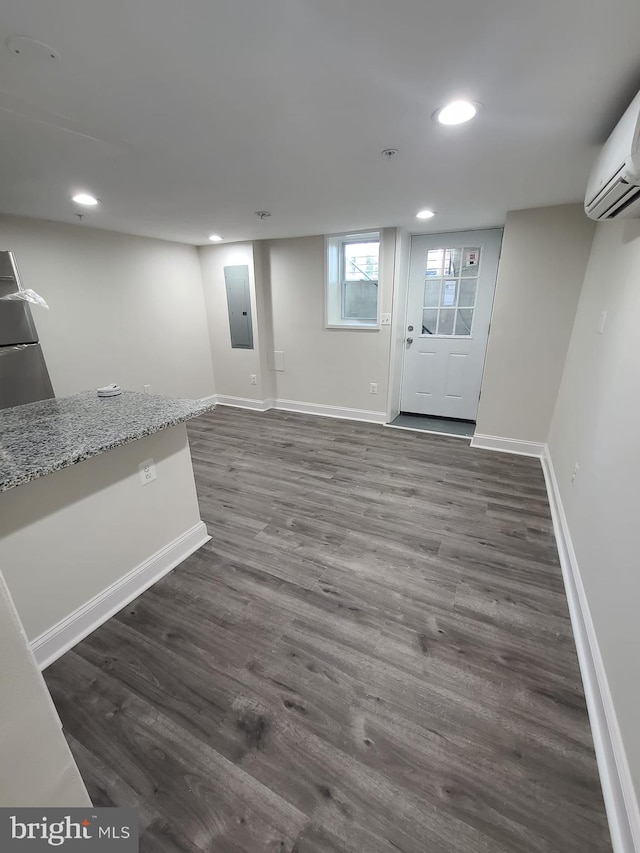 113 15th St SE, Washington, DC 20003 - below grade area with electric panel, recessed lighting, dark wood-type flooring, and a wall mounted AC