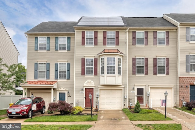 6827 Warfield St, Glen Burnie, MD 21060 - townhome / multi-family property with an attached garage and driveway