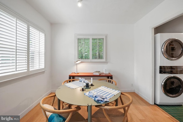 3503 Martha Custis Dr, Alexandria, VA 22302 - dining room with stacked washer / drying machine, plenty of natural light, and light wood finished floors