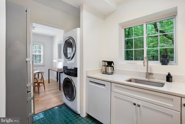3503 Martha Custis Dr, Alexandria, VA 22302 - washroom with stacked washing machine and dryer and dark tile patterned flooring
