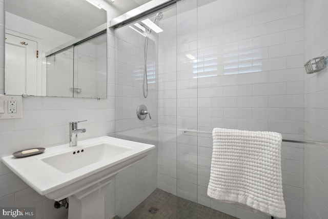 3503 Martha Custis Dr, Alexandria, VA 22302 - bathroom with a stall shower, tile walls, and a sink