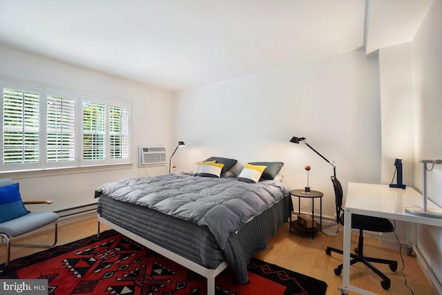 3503 Martha Custis Dr, Alexandria, VA 22302 - bedroom with wood finished floors, a baseboard radiator, and a wall mounted AC