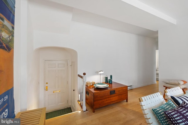 3503 Martha Custis Dr, Alexandria, VA 22302 - foyer featuring a baseboard radiator, arched walkways, and wood finished floors